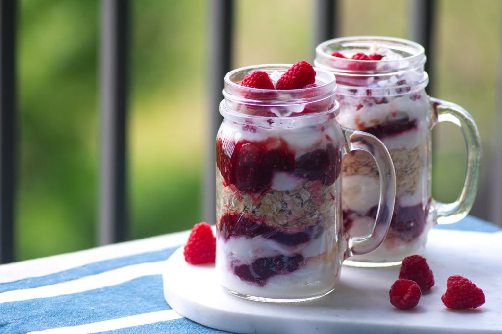 Overnight oatmeal with raspberries and yogurt.